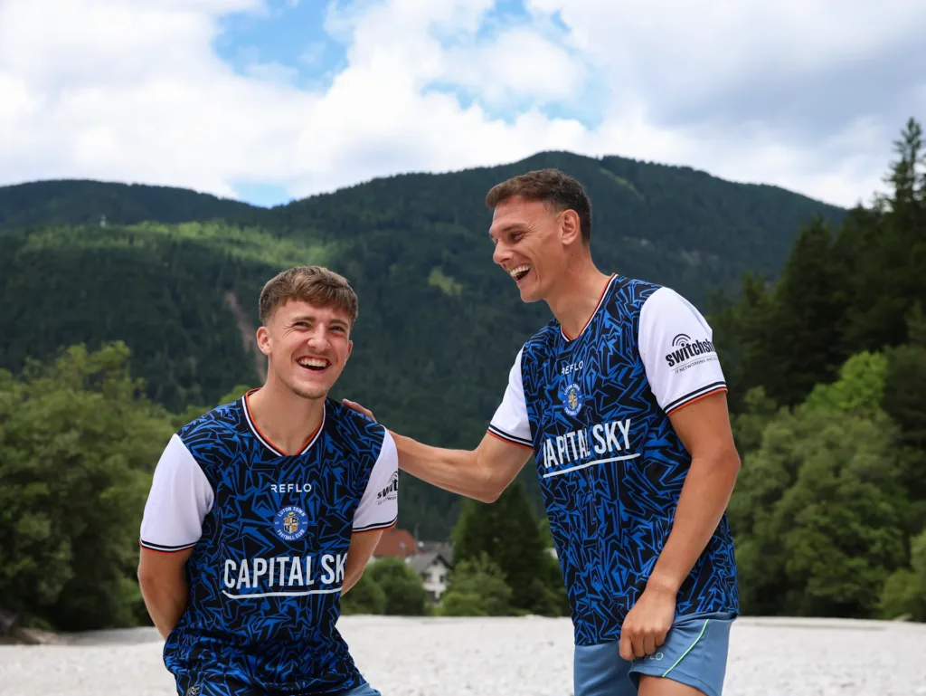 Luton Town FC away kit 2025/26 season featuring Capital Sky Luton Town team photoshoot of new away kit while on preseason training in Slovenia